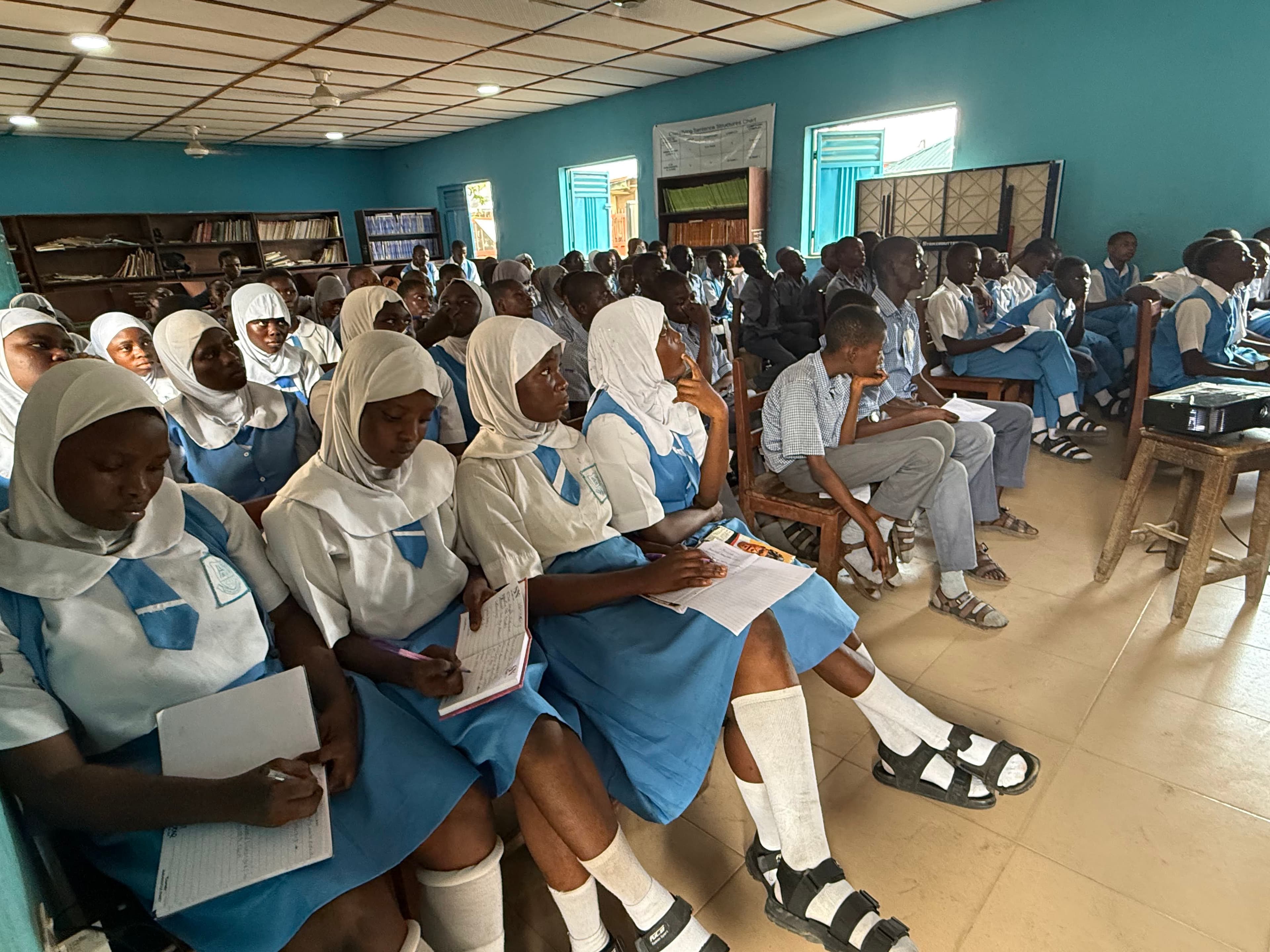 Full classroom engaged — behavioural change requires attention, not just information