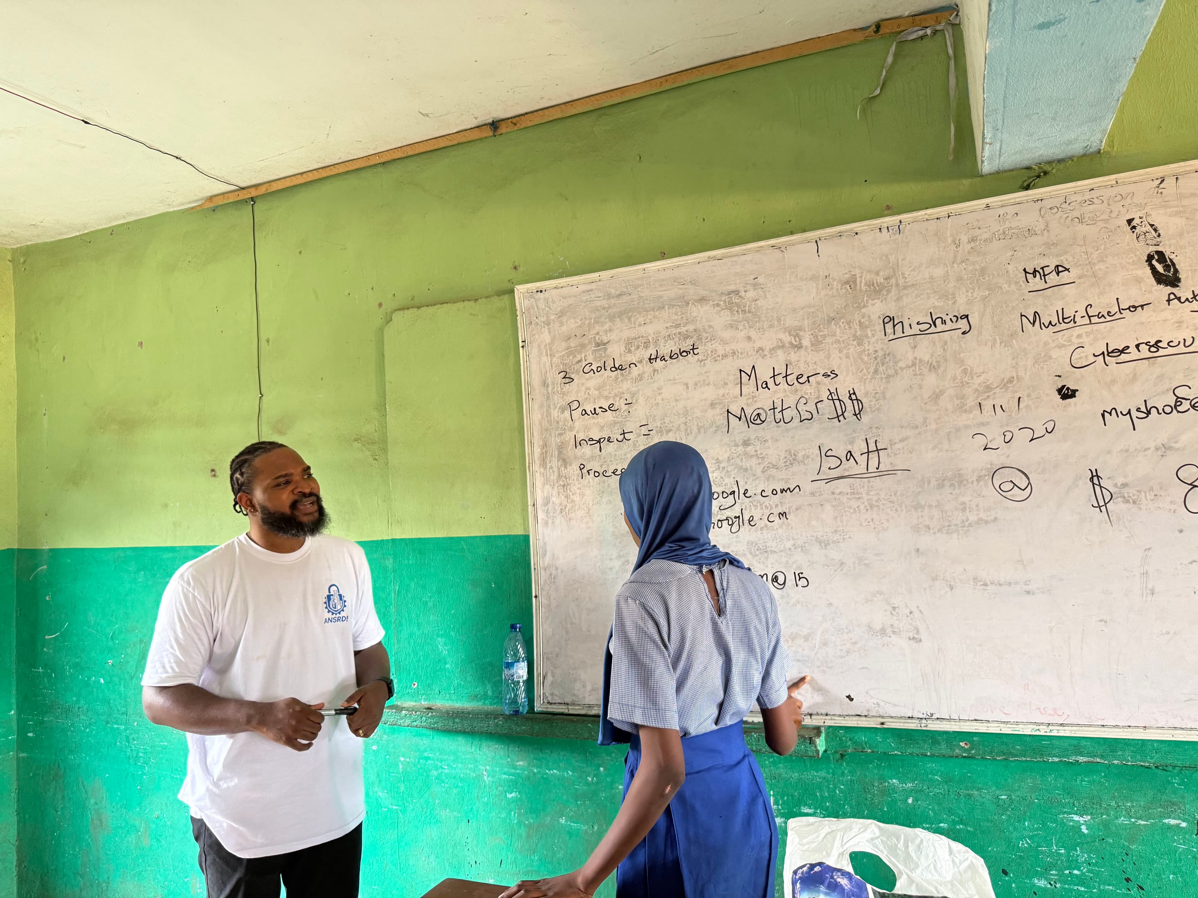 Student at the whiteboard creating strong passwords using behavioural cues